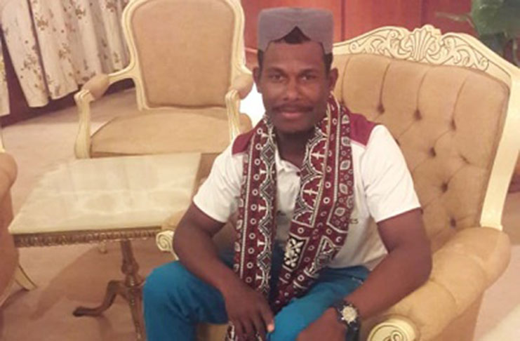 West Indies Twenty20 captain Jason Mohammed poses in his traditional Sindh Ajrak, on arrival in Karachi yesterday.