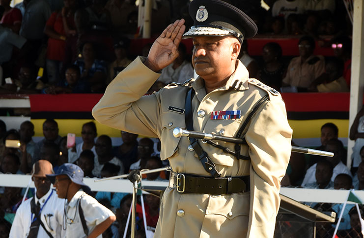 Outgoing Police Commissioner Seelall Persaud salutes Wednesday during his farewell parade at the Police Sports Club Ground, Eve Leary (Adrian Narine photo)