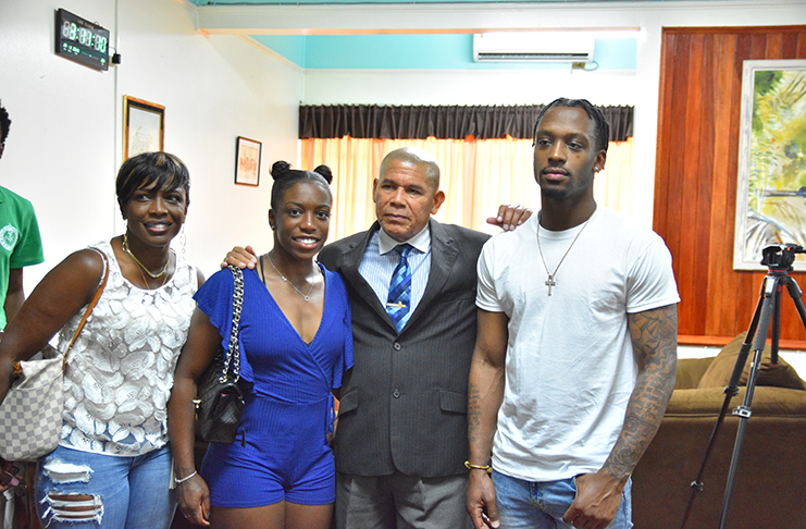 Sachia Vickery, along with her mother Paula Liverpool, brother and manager Dominique Mitchell, is seen with Minister of Social Cohesion, Dr George Norton, during her recent visit to Guyana. (Samuel Maughn photo)