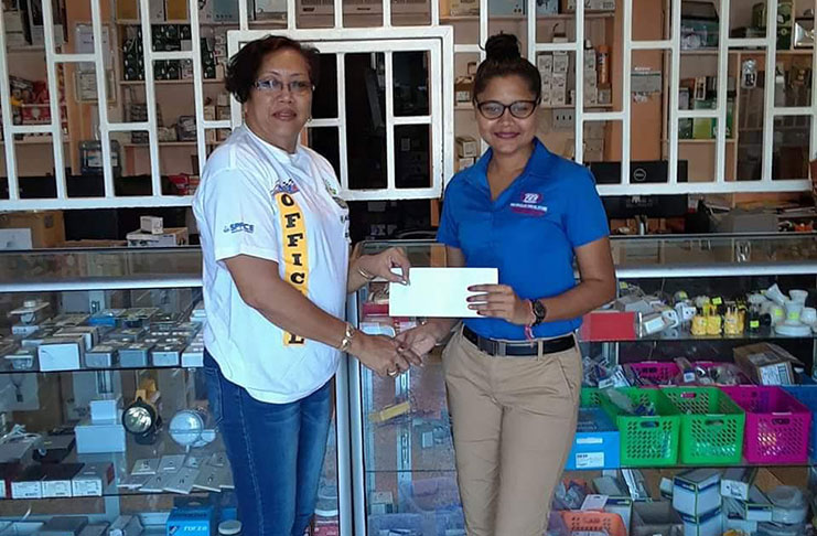 Prem’s Electrical representative, Darshanie Narine (right), hands over the sponsorship cheque to GMR&SC’s Desiree Lee.