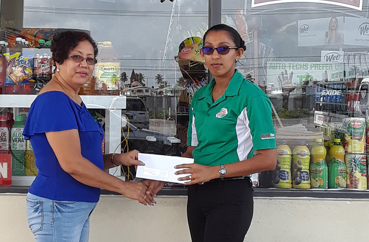 GMR&SC office executive Desiree Lee, collects the Choke sponsorship for the Starlet Cup.