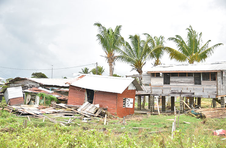 The drama and the destruction that unfolded
yesterday as the the Atlantic laid seige to the
sea defence at Den Amstel, on the West Coast of
Demerara