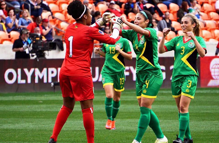 FLASHBACK: Guyana’s Chantel Sandiford is congratulated by sisters Kayla and Briana De Souza after pulling off a great save in their 2-1 win over Guatemala at the 2016 CONCACAF Women’s Olympic Qualifier tournament at the BBVA Compass Stadium in Houston, Texas.