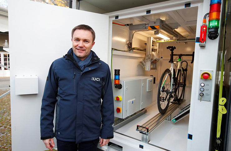 David Lappartient, president of the International Cycling Union (UCI) poses next to the X-ray machine after a news conference on the fight against technological fraud in Geneva, Switzerland, Wednesday. (REUTERS/Denis Balibouse)
