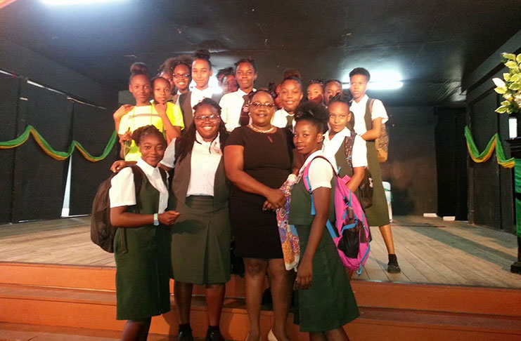 Mackenzie High School students seize the moment for a photo opportunity with the firebrand Minister within the Ministry of Natural Resources, Simona Broomes