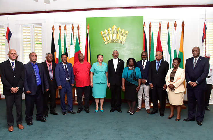 President David Granger; Minister of State, Joseph Harmon; and Minister of Communities, Ronald Bulkan pose with the newly sworn-in mayors and deputy mayors at State House (Ministry of the Presidency)