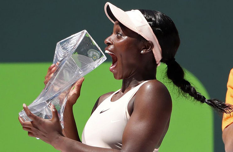 Sloane Stephens celebrates with her Miami Open trophy. (Reuters)