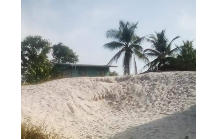 The illegal sandpit that the residents are using to construct their homes