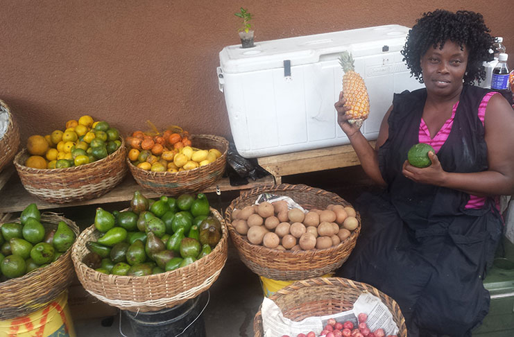 Fruit vendor Phillipa Braithwaite, the pineapple and the lemon – both with amazing health benefits and for which there is great demand locally
