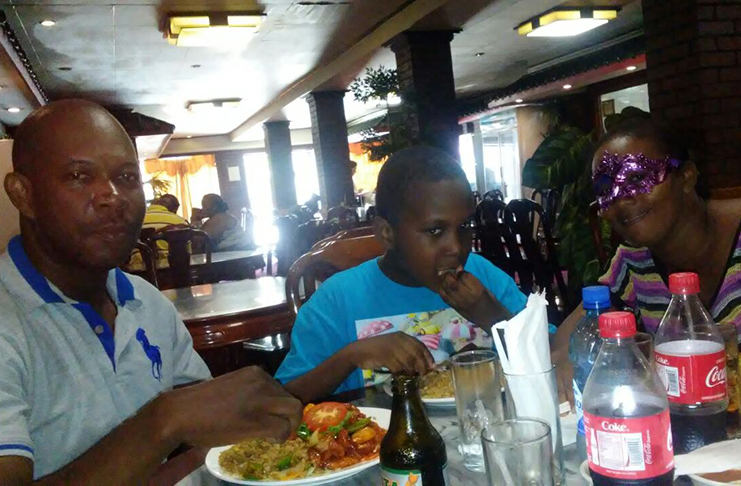 Joel out to eat with his father, left, and stepmother (Photo courtesy of Mark Dolphin)