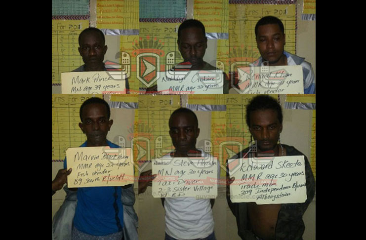 The six men following their arrest.