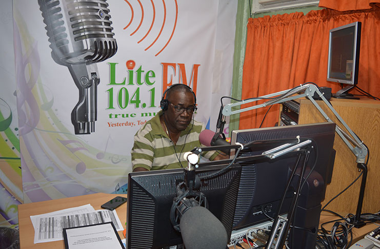 Veteran Guyanese broadcaster Bobby Vieira in studio at Radio Station Lite 104.1 FM.