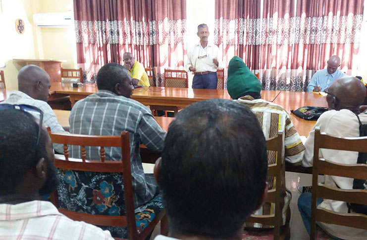 Veteran Coconut Technician, Chandrika Persaud, introducing his knowledge and experience in coconut husbandry practices to outdoor training