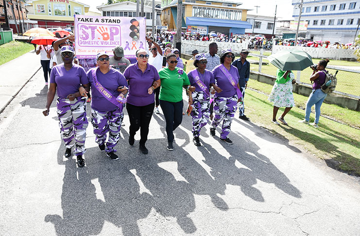Minister of Public Health, Volda Lawrence (third from right) and Mayor Patricia Chase-Green (third from left) and members of RISE, leading the march against domestic violence on Sunday (Samuel Maughn photo)