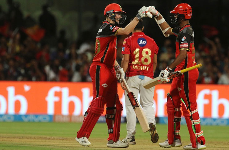 Chris Woakes and Washington Sundar celebrate the win.