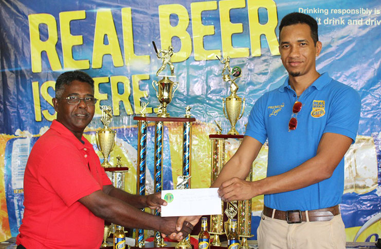 Sean Abel (right) presents the sponsorship cheque to Jitlall Jowharilall.