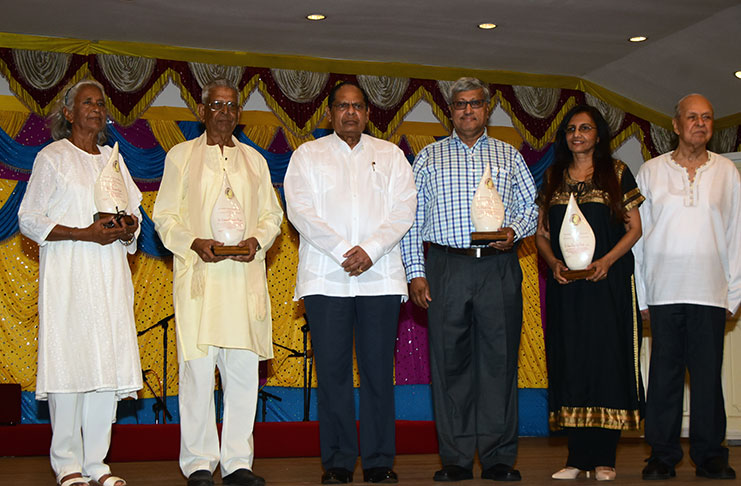 Prime Minister Moses Nagamootoo and Dr. Yesu Persaud, flanked by the awardees (Adrian Narine photo)