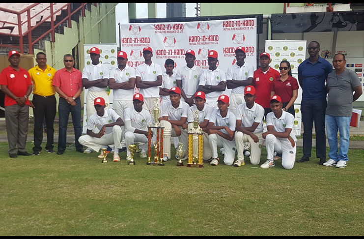 The winning Berbice team pose with officials of the GCB and representative of sponsor Hand-in-Hand Mutual Fire & Life Insurance Company.