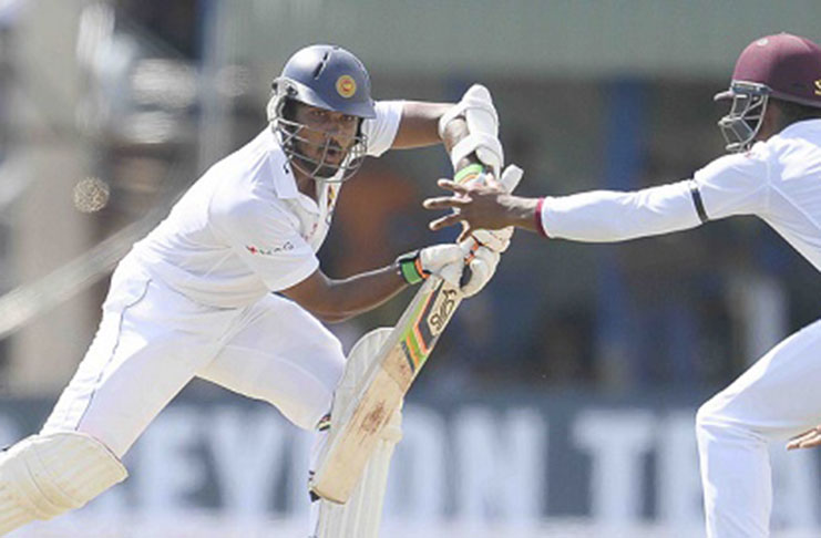 Sri Lanka captain Dinesh Chandimal strikes 108 on the opening day.