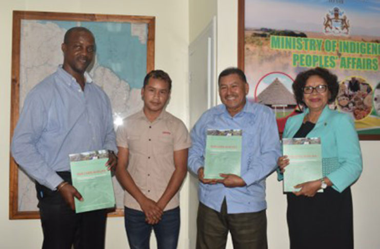 Indigenous Peoples’ Affairs Permanent Secretary Alfred King, Minister of Indigenous Peoples’ Affairs Sydney Allicock and Minister within the Ministry Valerie Garrido-Lowe with copies of the report