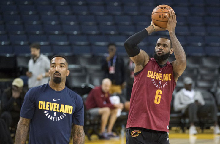 Cleveland Cavaliers forward LeBron James (right) shoots the basketball next to guard JR Smith (left) during NBA Finals media day at Oracle Arena. (Mandatory Credit: Kyle Terada-USA TODAY Sports)