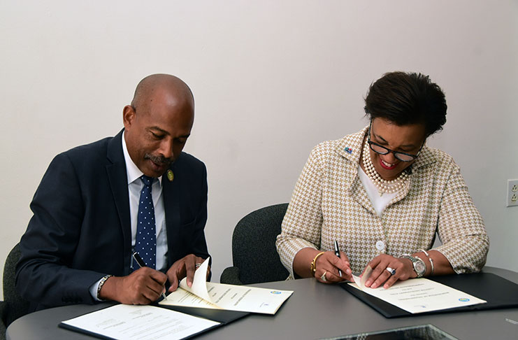 The MoU being signed between Commonwealth Secretary-General Patricia Scotland and CEO of the CDF, Rondinald Soomer, at the Pegasus Hotel. (Adrian Narine photo)