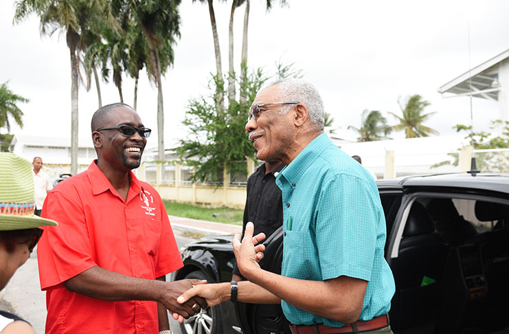 President David Granger being greeted by GTU President Mark Lyte upon his arrival at the union’s headquarters, Woolford Avenue, on Tuesday.