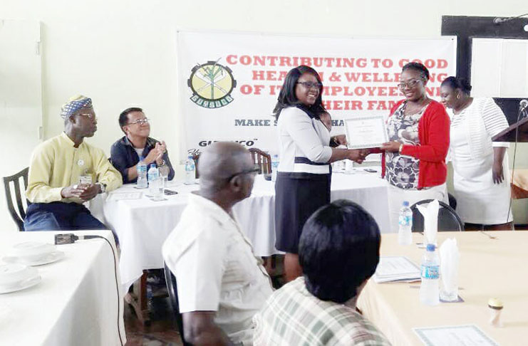 Gonzales (second from left) during the awarding of certificates by the Hon. Dr. Karen Cummings, Junior Minister of Public Health, to GuySuco’s medical health employees who participated in the “Brief Intervention for Drug Users” workshop (All photos courtesy of Ren Gonzales)
