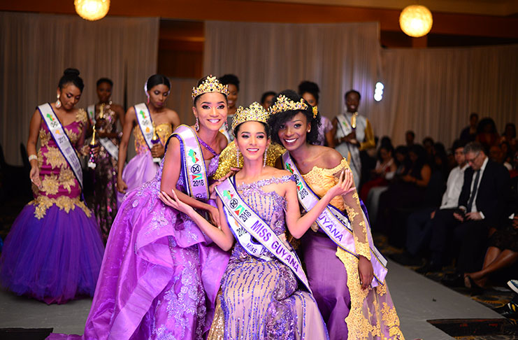 Miss World Guyana 2018, Ambika Ramraj (seated) is flanked by first runner-up, Tracy Smith (left), and second runner-up, Joylyn Conway  [Delano Williams photos]