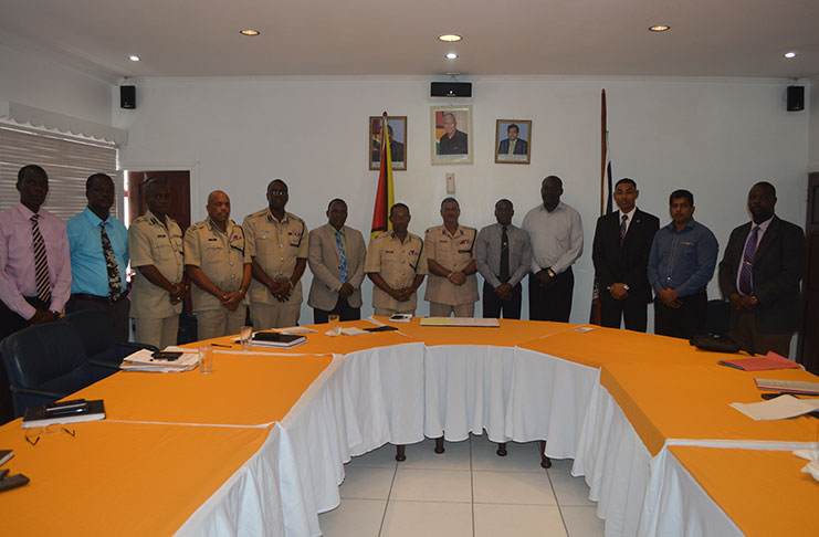 Commissioner of Police (ag) David Ramnarine (centre) flanked by senior members of the GPF and visiting KPS at Eve Leary