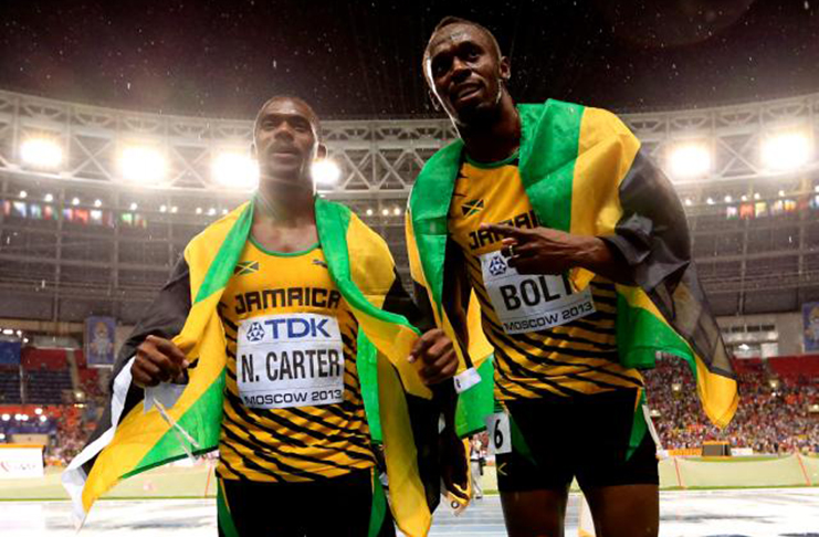 Nesta Carter (left) positive doping test means that Usain Bolt won’t get his ninth gold medal back. (Getty Images)