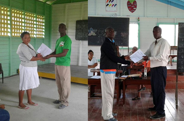 Regional Vice-Chairman Elroy Adolph presenting the toshaos of Kimbia and Calcuni respectively with their official documentation after the elections