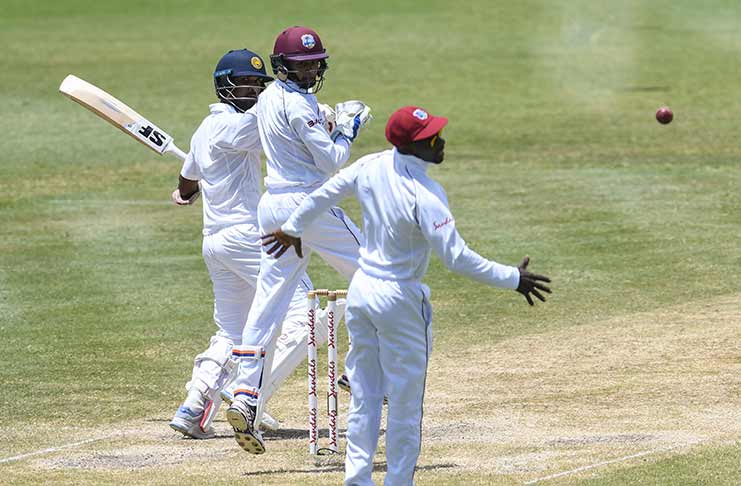 A close call for Dinesh Chandimal, as he edges wide of keeper Shane Dowrich and slip fielder Devon Smith on the fourth day of the second Test between WINDIES and Sri Lanka on Sunday, June 17, 2018 at the Darren Sammy Cricket Ground. © CWI Media/Randy Brooks of Brooks Latouche Photography