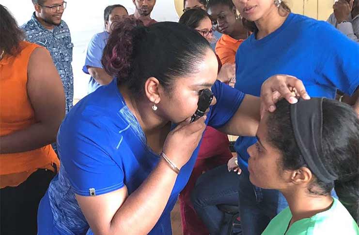 Dr. Jenell Sarju conducts a practical demonstration with doctors on ophthalmoscopy, during the Diabetes and Eye Workshop at WDRH on Sunday, June 10