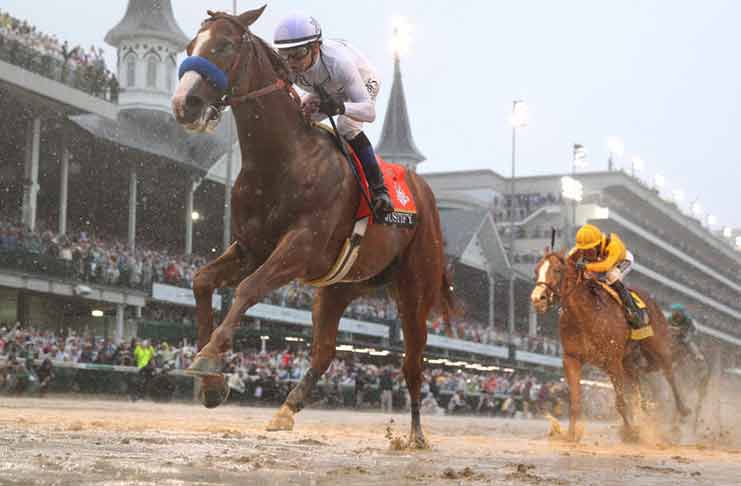Mike Smith aboard Justify crosses the finish line to win the 144th running of the Kentucky Derby at Churchill Downs, May 5. (Brian Spurlock-USA TODAY Sports)