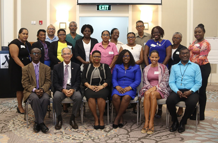 In the photo, from left to right] PAHO/WHO Representative, Dr. William Adu-Krow, President of the Healthy Caribbean Coalition, Sir Trevor Hassell, Minister of Public Health, Volda Lawrence, Minister within the Ministry of Public Health, Dr. Karen Cummings, Executive Director of Healthy Caribbean Coalition, Maisha Hutton and Chief Medical Officer (CMO), Dr. Shamdeo Persaud along with the Commissioners of the National Presidential Commission for Non-Communicable Diseases.