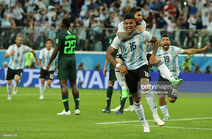 Marcos Rojo of Argentina celebrates with teammate Lionel Messi, after scoring his team's second goal during the 2018 FIFA World Cup Russia Group D match between Nigeria and Argentina at Saint Petersburg Stadium on June 26, 2018 in Saint Petersburg, Russia. (Photo by Richard Heathcote/Getty Images)