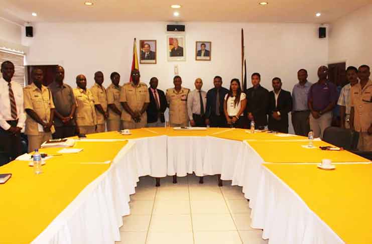 Police Commissioner (ag) David Ramnarine (centre) flanked by GCCI representatives and senior officers.