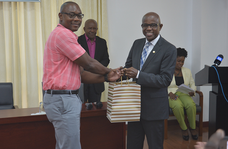 Secretary-General of the Caribbean Tourism Organisation (CTO), Hugh Riley receives a taste of Banks DIH best XM rum from the company’s representative.