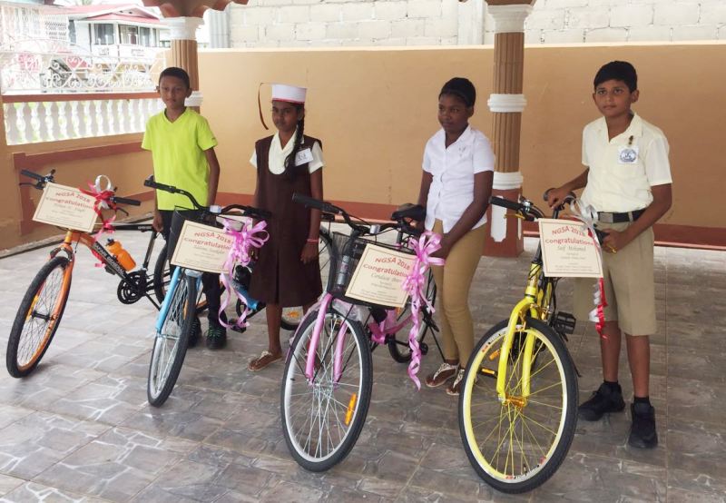 The four students with their new bicycles.