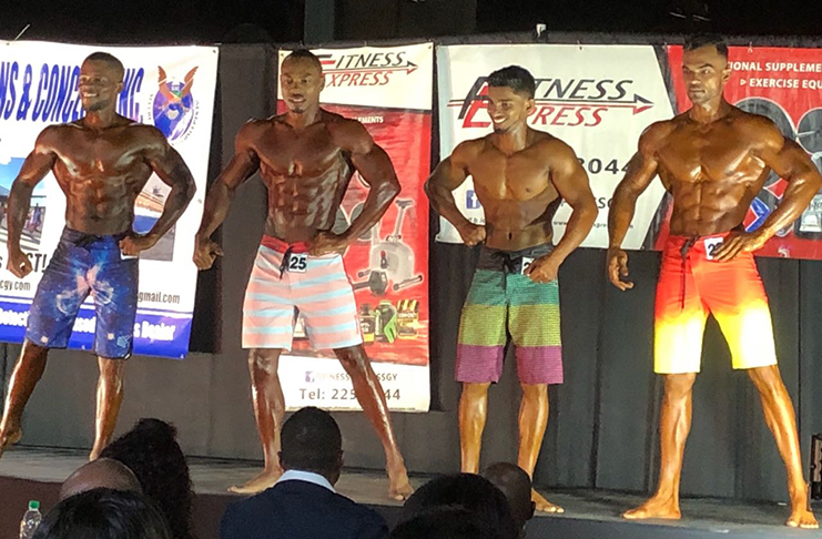 Winner of the Mr Physique title, Emmerson Campbell, (second from left) flexes alongside his rivals Yannick Grimes (left), Caerus Cipriani (right) and Chetram Nagessar (second from right).
