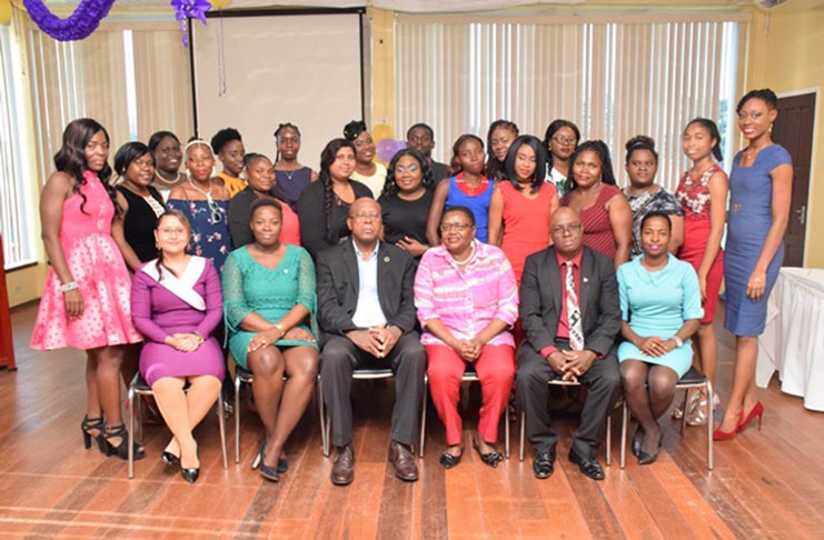 The graduating class with officials from the Ministry of the Presidency