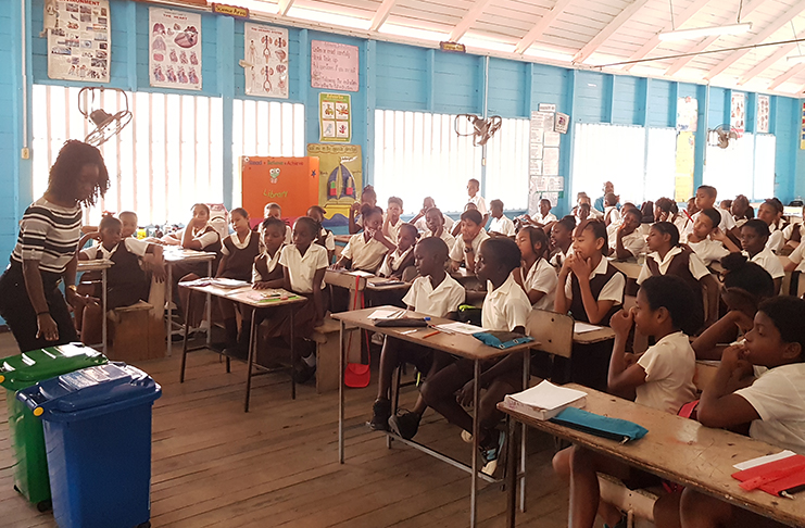 Students of the St. Ambrose Primary School listening attentively during a presentation from Public Relations Officer Danielle Campbell-Lowe