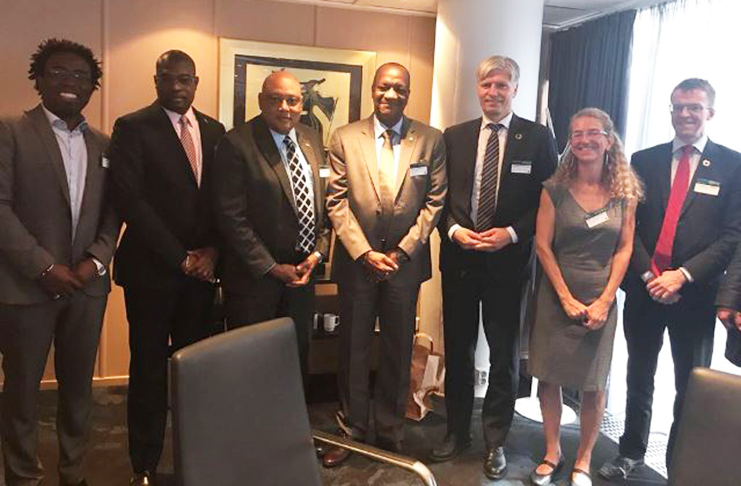 Minister of State Joseph Harmon, Minister of Natural Resources Raphael Trotman and Minister of Public Infrastructure, David Patterson, along with the Norwegian ministerial team in Oslo, Norway.