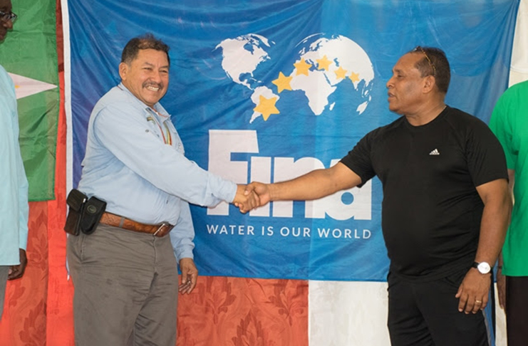 Minister of Indigenous People’s Affairs, Sydney Allicock and President of the Guyana Amateur Swimming Association, Ivan Persaud at the launch of the Guyana Amateur Swimming Association outreach in Mainstay/Whyaka.