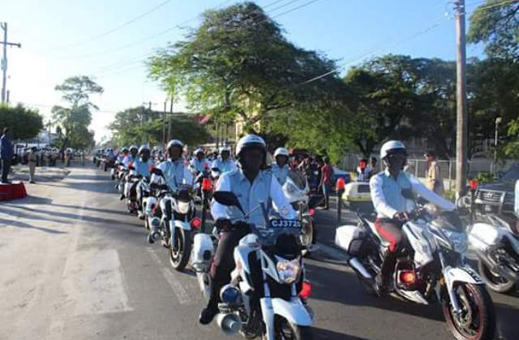 Members of the Police Traffic Division ride uniformly along the march route Saturday morning.