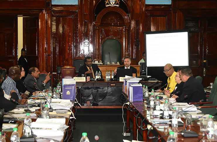 Members of Parliament engage in a discourse on bribery, corruption, fraud and money laundering on Wednesday in the Parliament Chamber. (Adrian Narine photo)