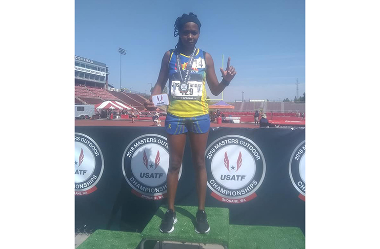 Euleen Josiah-Tanner displays her spoils for winning the 5 000m in her first-ever USATF Masters Outdoor Championships.