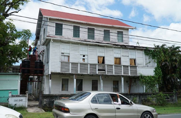 The dilapidated apartment building on Quamina Street