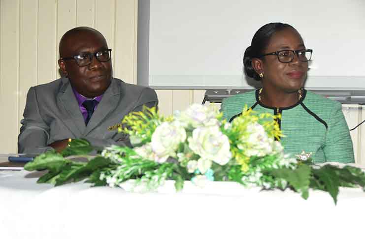 CEO Marcel Hutson and Education Minister, Nicolette Henry, during the ceremony to announce the NGSA results (Adrian Narine photo)